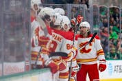  Calgary Flames defenceman Chris Tanev celebrates after scoring a goal against the Dallas Starsat American Airlines Center in Dallas on Jan. 14, 2023.