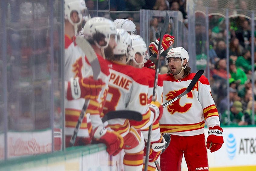  Calgary Flames defenceman Chris Tanev celebrates after scoring a goal against the Dallas Starsat American Airlines Center in Dallas on Jan. 14, 2023.