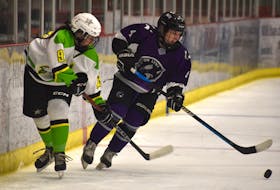 Alexis Chisholm-Beaton of the Cape Breton Lynx, right, battles for the puck with Jorja Hambly of the Eastern Stars during Maritime Major Female Hockey League action at the Membertou Sport and Wellness Centre in Membertou, N.S., on Saturday. Cape Breton won the game 4-2. Jeremy Fraser/SaltWire Network