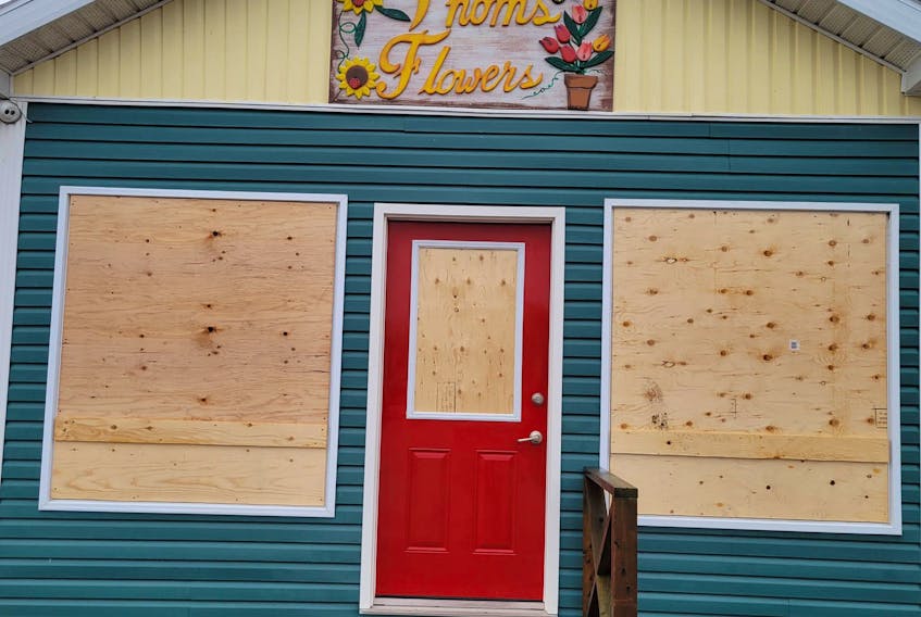 The windows at Thoms Flowers were boarded up on Monday after the windows in the Glace Bay flower shop were smashed by vandals on Friday night. Homes and businesses in the area are reporting damage that same night. CONTRIBUTED