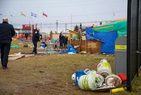 Charlottetown fire members confiscated a number of propane tanks, cooking equipment and a burnt barrel after smoke was seen flowing from the Charlottetown tent encampment Jan. 17. - Cody McEachern