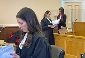 Prosecutor Jacqueline MacMillan (foreground), defence lawyer Rosellen Sullivan and high school teacher Krysta Grimes — who is charged with sexually exploiting a 16-year-old high school student by having a sexual encounter with him in 2018 — are pictured in Newfoundland and Labrador Supreme Court in St. John's Jan. 13, 2023.