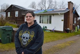 Jessica Reid-Lynk outside her Westmount home. It was damaged in post-tropical storm Fiona in September. GREG MCNEIL/CAPE BRETON POST