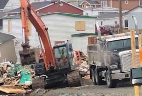 Excavators and dump trucks are a common sight around Port aux Basques as the cleanup from post-tropical storm Fiona continues. This week eight homes destroyed or damaged beyond repair are being torn down in the Mouse Island area of town.  – Photo Contributed by Terry Osmond