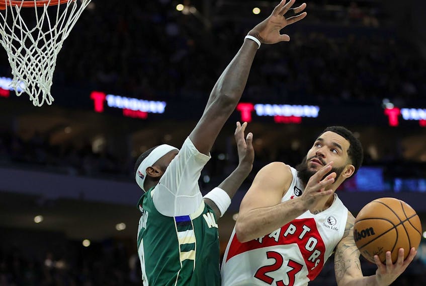 Fred VanVleet #23 of the Toronto Raptors is defended by Bobby Portis #9 of the Milwaukee Bucks during the second half of a game at Fiserv Forum on January 17, 2023 in Milwaukee, Wisconsin. 