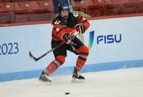 Team Canada forward Shae Demale of the Saint Mary's Huskies delivers a pass during action at the FISU Winter World University Games against Great Britain on Tuesday night in Potsdam, N.Y. - U SPORTS