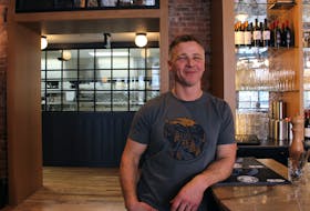 Sea Rocket Oyster House owner Richard Court stands at the bar in the Charlottetown restaurant. Court said he looks forward to the benefits the 2023 Canada Winter Games will have on the local economy. George Melitides • The Guardian