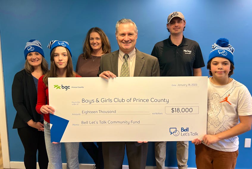BGC Prince County's Jody Sentner, left, Annika Doucette, BGC Prince County Dara Rayner, Bell Aliant's Tim Wolfe, BGC Prince County's Morgan Carlile and Riley Skevington with the Bell Let's Talk funding cheque. Contributed