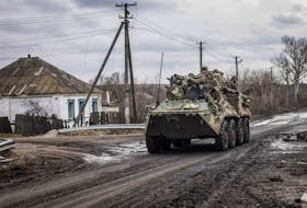 Ukrainian servicemen ride an Armoured Personnel Carrier (APC), as Russia's attack on Ukraine continues, in the village of Torske, Donetsk region, Ukraine December 30, 2022.  REUTERS/Yevhen Titov