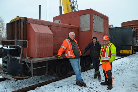 Members of the Middleton Railway Museum’s acquisitions team were happy to see the Plymouth engine put in place Dec. 29. From left are John MacDonald, Allison Bell and Rick Jacques.
Lawrence Powell