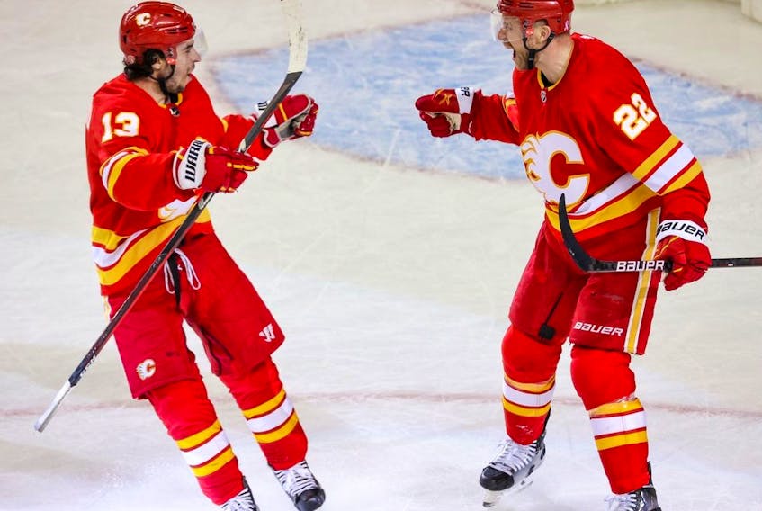  Calgary Flames Johnny Gaudreau and Trevor Lewis celebrate Lewis’ empty net goal leading to a 3-1 victory over the Dallas Stars in game 5 of Stanley Cup playoff action in Calgary on Wednesday, May 11, 2022.