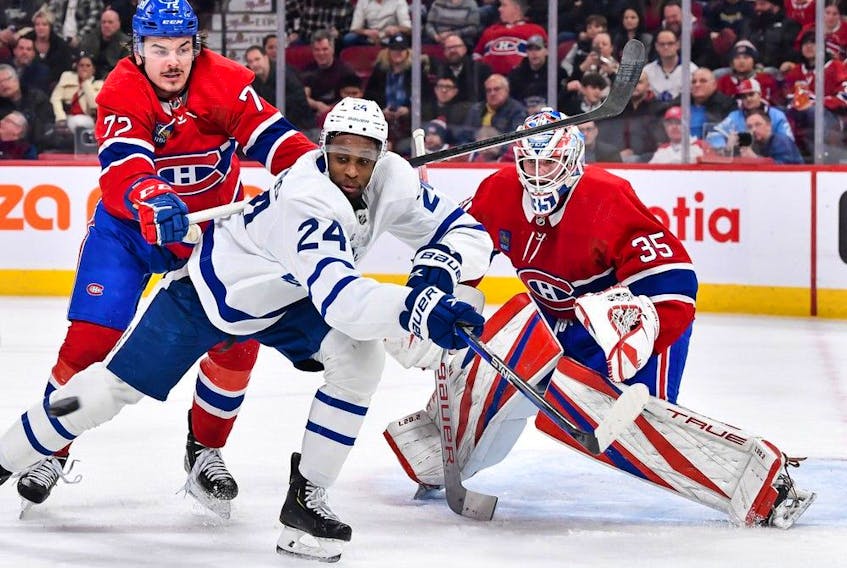 Canadiens' Arber Xhekaj (72) defends against Wayne Simmonds (24) of the Toronto Maple Leafs during the first period at the Bell Centre on Saturday, Jan. 21, 2023, in Montreal.