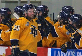 Yarmouth Mariners forward Ryan Semple celebrates his second period goal with his teammates Jan. 22 in Berwick.