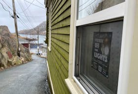 Residents of the Outer Battery are fed up with the bright lights shining into their windows all night, and many homes have posters, such as the one pictured, affixed to their properties in protest. Juanita Mercer • SaltWire Network