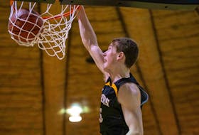Dalhousie's Malcolm Christie dunks in the dying seconds of Saturday's AUS basketball game to cap off a 30-point performance. - TREVOR MacMILLAN / DAL ATHLETICS