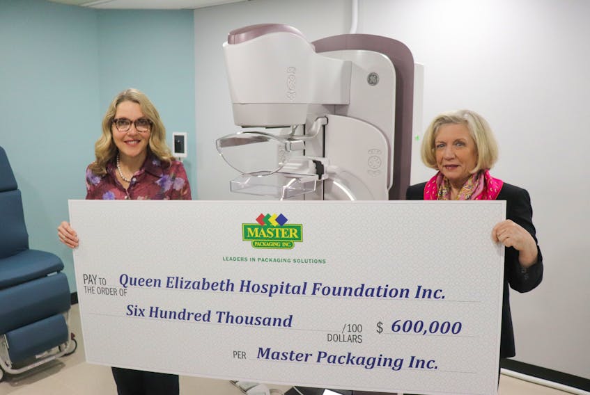 Master Packaging CEO Mary-Jean Irving, right, and QEH radiologist Dr. Kim Hender stand by the new digital mammography machine funded with a $600,000 commitment from Master Packaging. Contributed