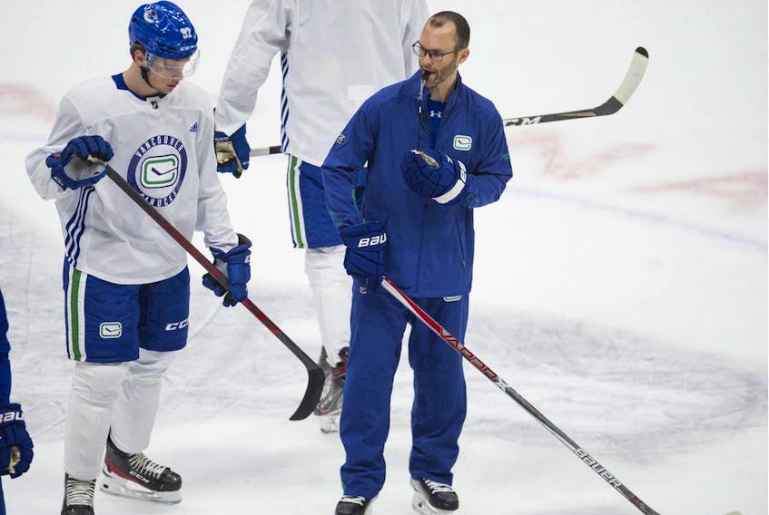 Corner Brook native Jason King (right), shown in this file photo from 2021, is remaining on as an assistant with the Vancouver Canucks after the Canucks fired head coach Bruce Boudreau and one of his assistants, Trent Cull, over the weekend. Boudreau is being replaced by Rick Tocchet. Jason Payne/Postmedia/Telegram file photo