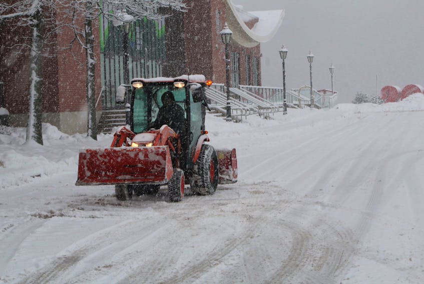 A snowplow clears the parking area in front of the Delta Hotels by Marriott in Charlottetown on Jan. 23. Rafe Wright • The Guardian