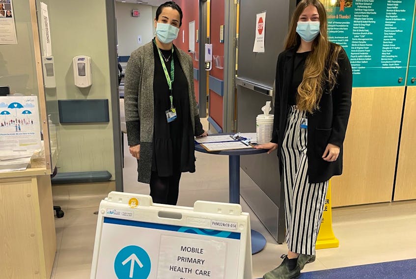 Meriem Moqtad, interprofessional practice learning leader at Nova Scotia Health and Shalyn Henley, NSH research associate with research, innovation and discovery, tour a mobile health unit. - Nova Scotia Health