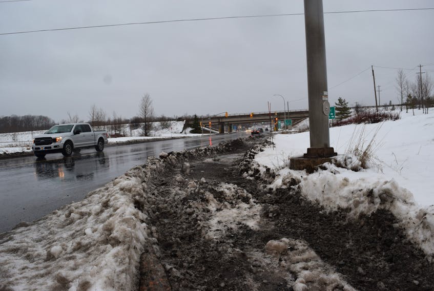 Even with a portion plowed, the path through Blue Acres was a slushy mess on Jan. 23. Municipality of Pictou County councillors recently debated whether neighbouring towns should chip in on sidewalk costs in this area. - Adam MacInnis