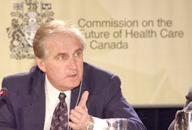 Commissioner Roy Romanow discusses a point during hearings of the Commission on the Future of Health Care in Canada in St. John's, Newfoundland Monday April 15, 2002. (THE ST. JOHN'S TELEGRAM/KEITH GOSSE)