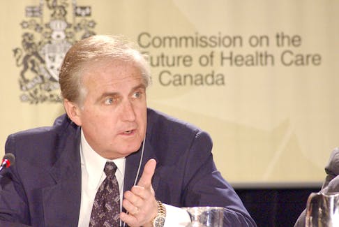 Commissioner Roy Romanow discusses a point during hearings of the Commission on the Future of Health Care in Canada in St. John's, Newfoundland Monday April 15, 2002. (THE ST. JOHN'S TELEGRAM/KEITH GOSSE)