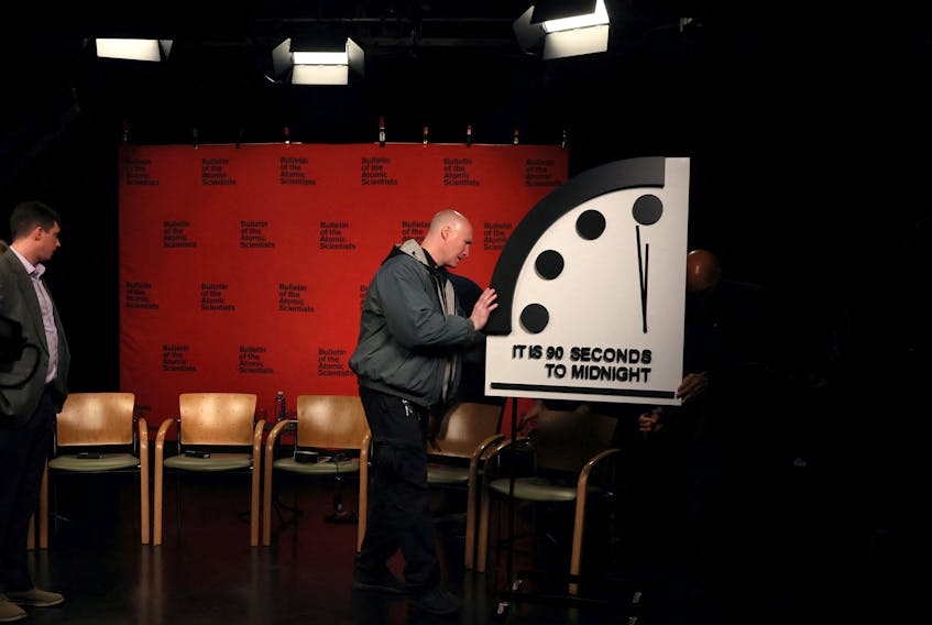 The clock with the Bulletin of the Atomic Scientists is being placed at a TV studio ahead of the announcement of the location of the minute hand on its Doomsday Clock, indicating what world developments mean for the perceived likelihood of nuclear catastrophe, at the National Press Club in Washington, U.S., January 24, 2023. REUTERS/Leah Millis  The clock with the Bulletin of the Atomic Scientists is placed at a TV studio at the National Press Club in Washington on Tuesday, ahead of the announcement of the location of the minute hand on its Doomsday Clock, indicating what world developments mean for the perceived likelihood of nuclear catastrophe. The clock was reset to represent 90 seconds before midnight, the closest it has ever been to a nuclear holocaust. REUTERS/Leah Millis