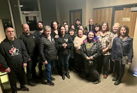 Stacey Cook, Colton Cook's mother, is surrounded by family, friends and supporters at the Yarmouth Justice Centre on the evening of Jan. 26 when a Supreme Court jury delivered the verdicts of guilty for the man accused of killing her son. TINA COMEAU PHOTO