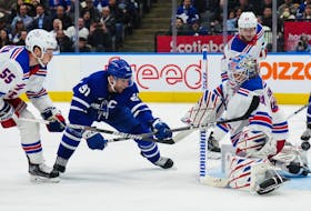 New York Rangers goaltender Igor Shesterkin makes a save on Maple Leafs' John Tavares as Rangers' Ryan Lindgren defends during the second period in Toronto on Wednesday, Jan. 25, 2023. 