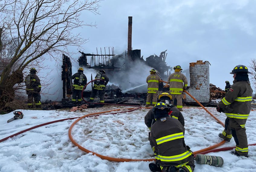 Firefighters from three departments spray water on a fire that destroyed a two-storey farmhouse in Nine Mile Creek on Jan. 26. Contributed