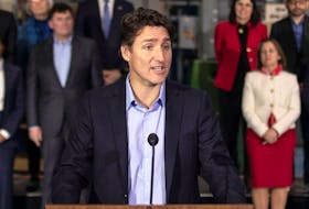 Prime Minister Justin Trudeau, joined by members of the Liberal Cabinet, speaks to reporters in Hamilton, Ont., on January 25, 2023.