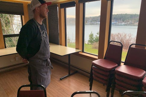 With yachts on the Northwest Arm in the background, chef Colin Bebbington checks out the Atlantic School of Theology space that will be the site of his new popup restaurant.