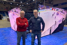 John Abbott, left, interim general manager of the Eastlink Centre in Charlottetown, and Mark Fisher, president of the Gemini Group of Companies, say the new 360-degree digital scoreboard will be installed for the Jan. 27 Atlantic University Sport men’s hockey game featuring UPEI and Saint Mary’s. Dave Stewart • The Guardian