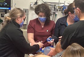 Staff at Inverness Consolidated Memorial Hospital practice emergency room skills on a simulator touring eastern Nova Scotia.
