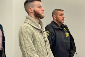 Sheldon Hibbs stands next to a sheriff officer in provincial court earlier this week. On Thursday morning, Hibbs was committed to stand trial on a charge of murder in connection with the death of 68-year-old Michael King in St. John’s in 2021. SaltWire Network file photo