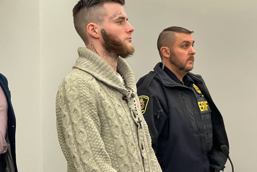 Sheldon Hibbs stands next to a sheriff officer in provincial court earlier this week. On Thursday morning, Hibbs was committed to stand trial on a charge of murder in connection with the death of 68-year-old Michael King in St. John’s in 2021. SaltWire Network file photo