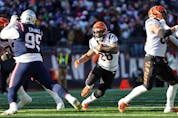 Joe Mixon of the Cincinnati Bengals runs the ball during the first quarter against the New England Patriots at Gillette Stadium on December 24, 2022 in Foxborough, Mass. (Winslow Townson/Getty Images)