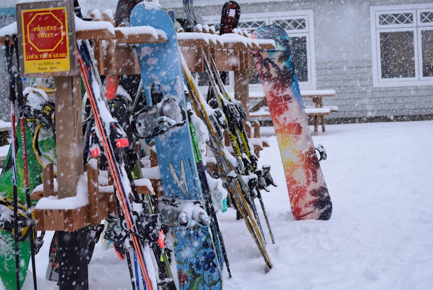 Skis and snowboards lined the racks at Ski Martock during the first real snowfall of the season.