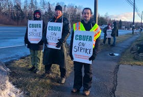 From left, Assistant professors Éric  thériault, Jan Hancock and McLennon Wilson on the picket line outside Cape Breton University at 8 a.m. Friday morning, and hour and a half after Cape Breton University Faculty Association went on strike. NICOLE SULLIVAN/CAPE BRETON POST