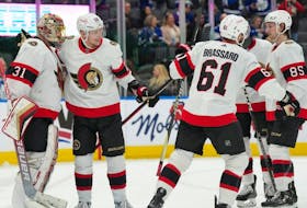 Members of the Ottawa Senators celebrate after their team's win against the Toronto Maple Leafs at Scotiabank Arena on Jan. 27, 2023.