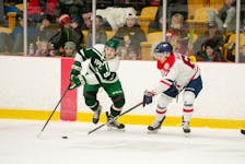UPEI's Kyle Maksimovich battles for the puck in a 3-2 to loss to Acadia on Saturday, Jan. 28, 2023. Contributed