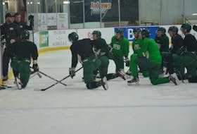 UPEI Panthers assistant coach Morgan MacDonald explains a drill as head coach Forbie MacPherson and the players look on during a recent practice at MacLauchlan Arena. The Panthers open the second half of the 2022-23 Atlantic University Sport Men’s Hockey Conference with a home game against the Moncton Blue Eagles on Jan. 4 at Eastlink Centre in Charlottetown. Jason Simmonds • The Guardian