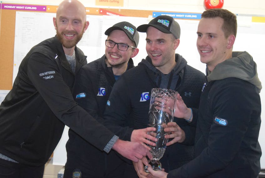 Team  Manuel celebrates after capturing the Nova Scotia Tankard at the Bluenose Curling Club in New Glasgow on Monday. From left are coach Kevin Patterson, skip Matthew Manuel third Luke Saunders and lead Nick Zachernuk. Missing is second Jeff Meagher. - Adam MacInnis