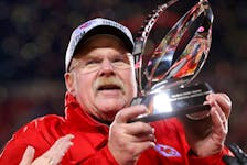 Head coach Andy Reid of the Kansas City Chiefs holds up the Lamar Hunt Trophy after defeating the Cincinnati Bengals 23-20 in the AFC Championship Game at GEHA Field at Arrowhead Stadium on Jan. 29, 2023 in Kansas City, Miss. 