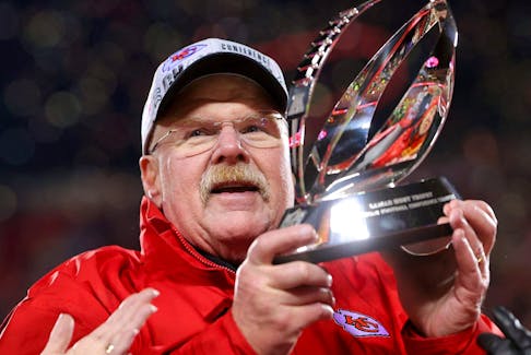 Head coach Andy Reid of the Kansas City Chiefs holds up the Lamar Hunt Trophy after defeating the Cincinnati Bengals 23-20 in the AFC Championship Game at GEHA Field at Arrowhead Stadium on Jan. 29, 2023 in Kansas City, Miss. 