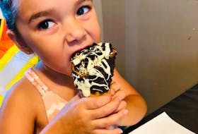 Jacqueline Knockwood, 4, of Membertou enjoys a treat from Heavenly Sweet Creations, which will soon have a cafe in Sydney.  CONTRIBUTED