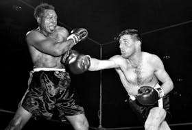 Yvon Durelle, right, fights Archie Moore at the Forum in Montreal on Dec. 10, 1958. Associated Press