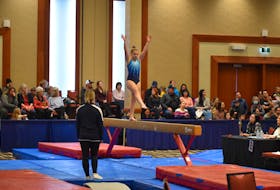 Island Gymnastics Academy athlete Wren Morris shows her skills on the beam at the Prince Edward Classic gymnastic competition Jan. 29 in Charlottetown. Alison Jenkins • The Guardian
