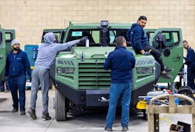 Employees work on the Senator APC at vehicle manufacturer Roshel after Canada's defence minister announced the supply of 200 Senator armoured personnel carriers to Ukraine. 