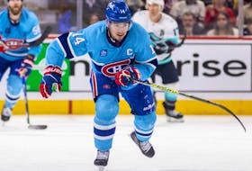 Montreal Canadiens centre Nick Suzuki skates through centre ice during third period against the Seattle Kraken in Montreal on Jan. 9, 2023.